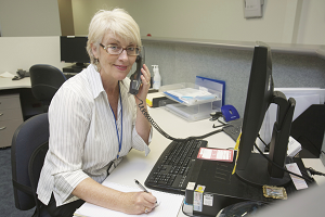 Photograph of employee talking on phone