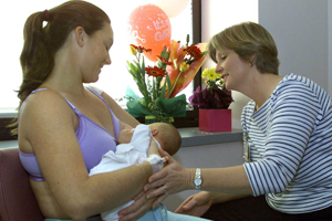 A woman breastfeeding a new baby