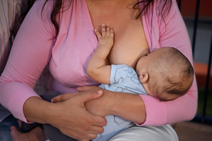 high angle mother breastfeeding baby 