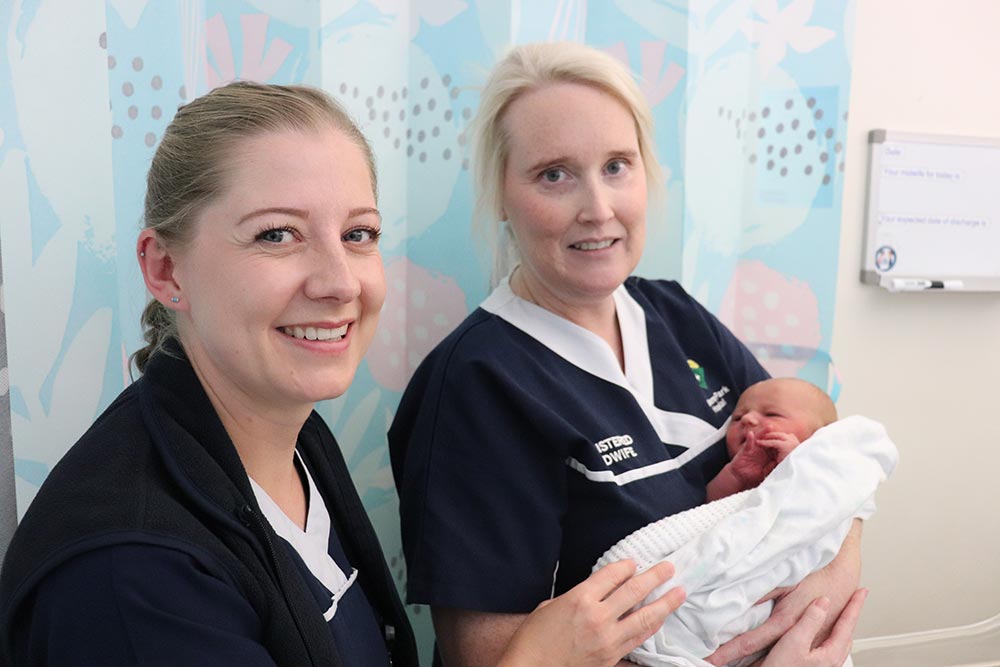 Two midwives and a baby