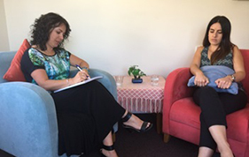 Survivor and counsellor in a counselling session