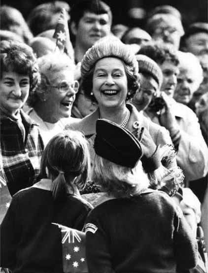 Early photograph of Queen Elizabeth II surrounded by crowds